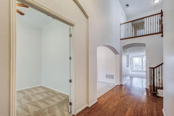 a view of gallery with wooden floor