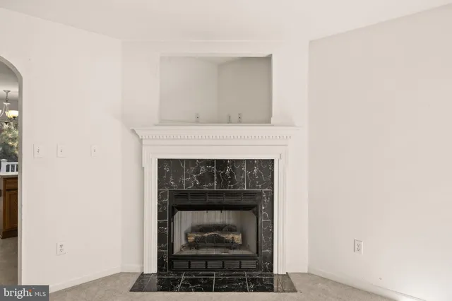 a living room with a fireplace