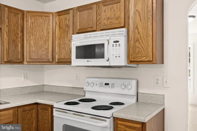 a kitchen with a stove and a microwave