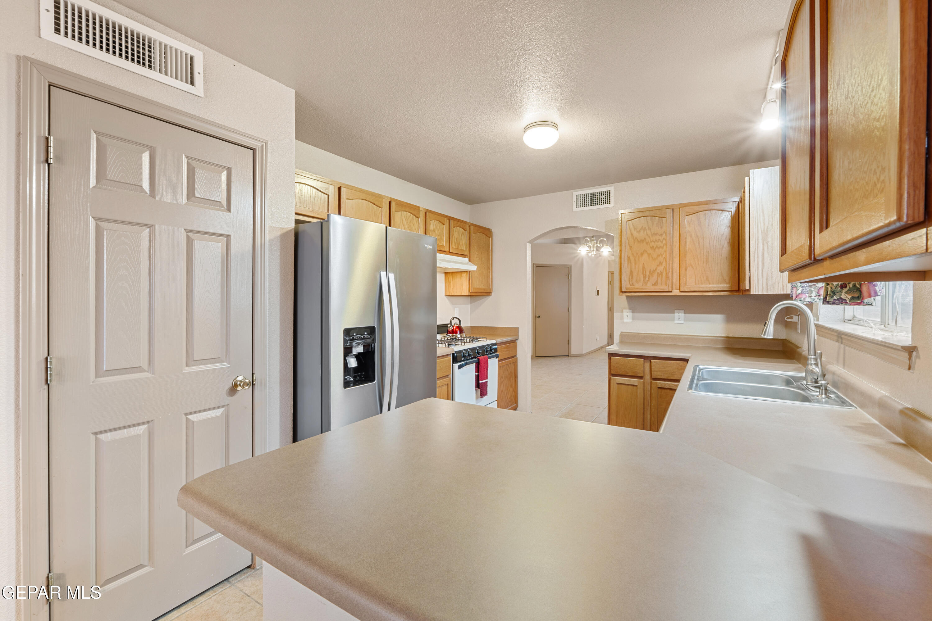 3849 Tierra Roca Place El Paso, TX 79938 - Photo 16 of 44 a view of a kitchen with furniture and large window