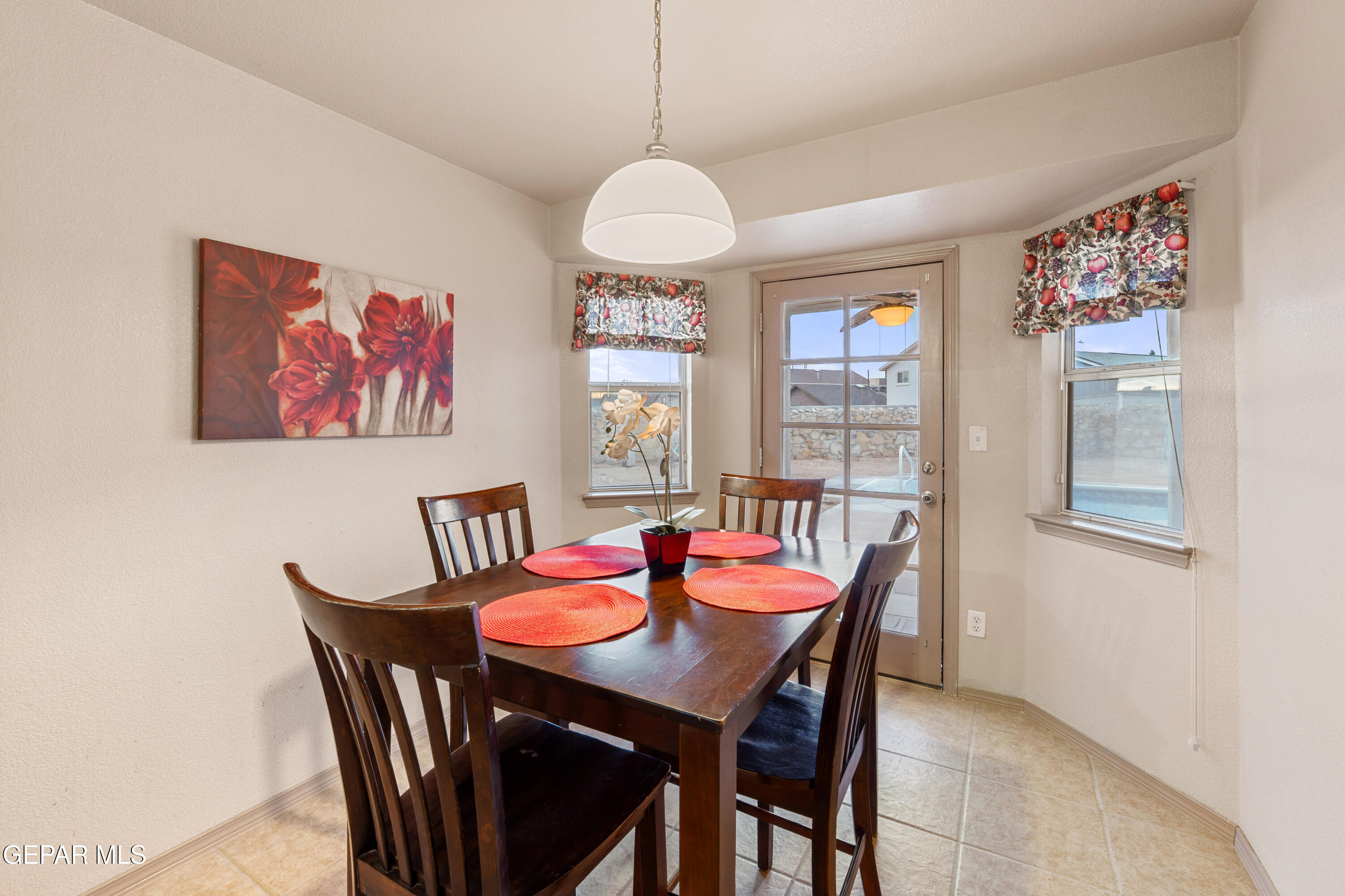 3849 Tierra Roca Place El Paso, TX 79938 - Photo 19 of 44 a dining room with furniture and window