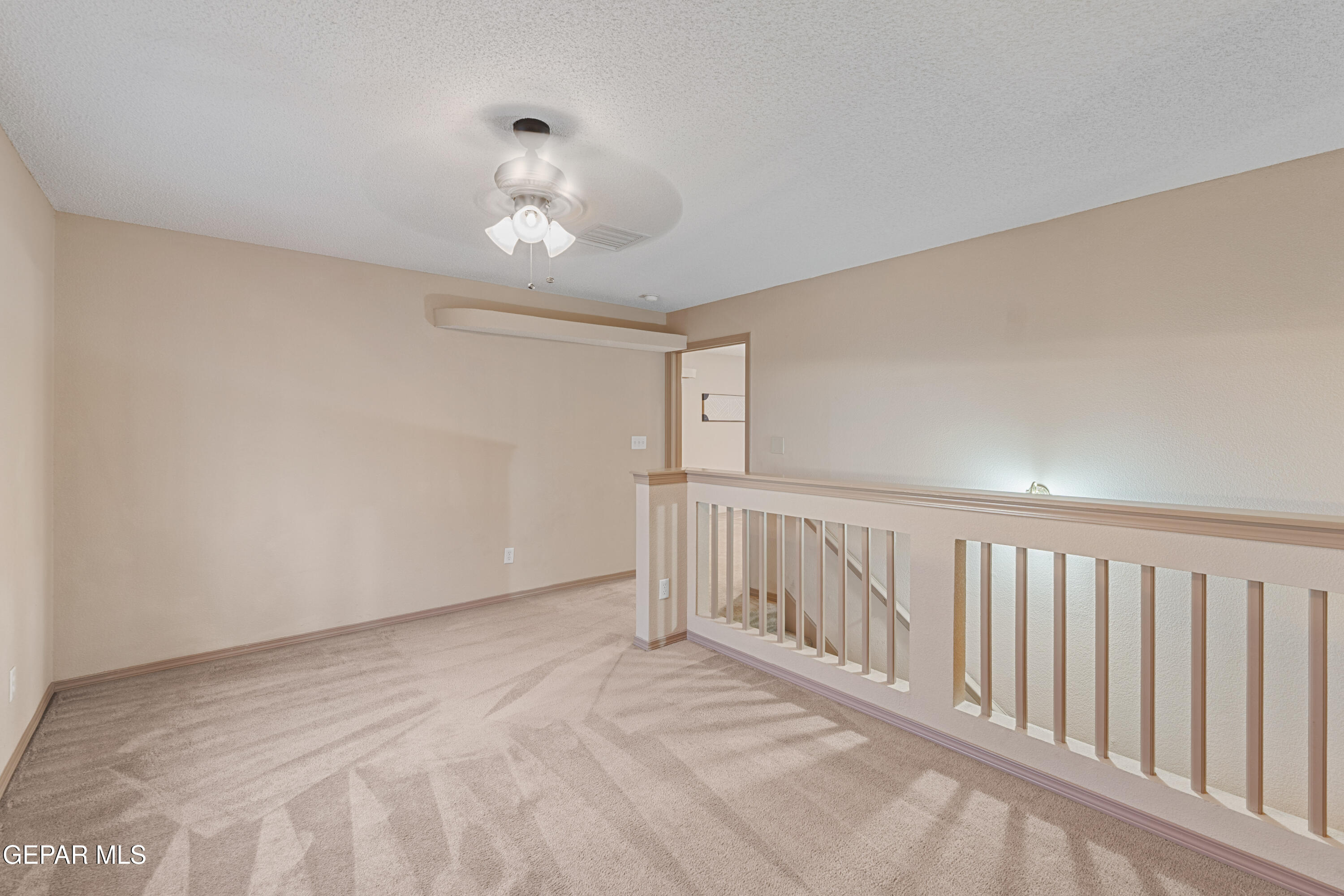 3849 Tierra Roca Place El Paso, TX 79938 - Photo 31 of 44 a view of staircase with white walls