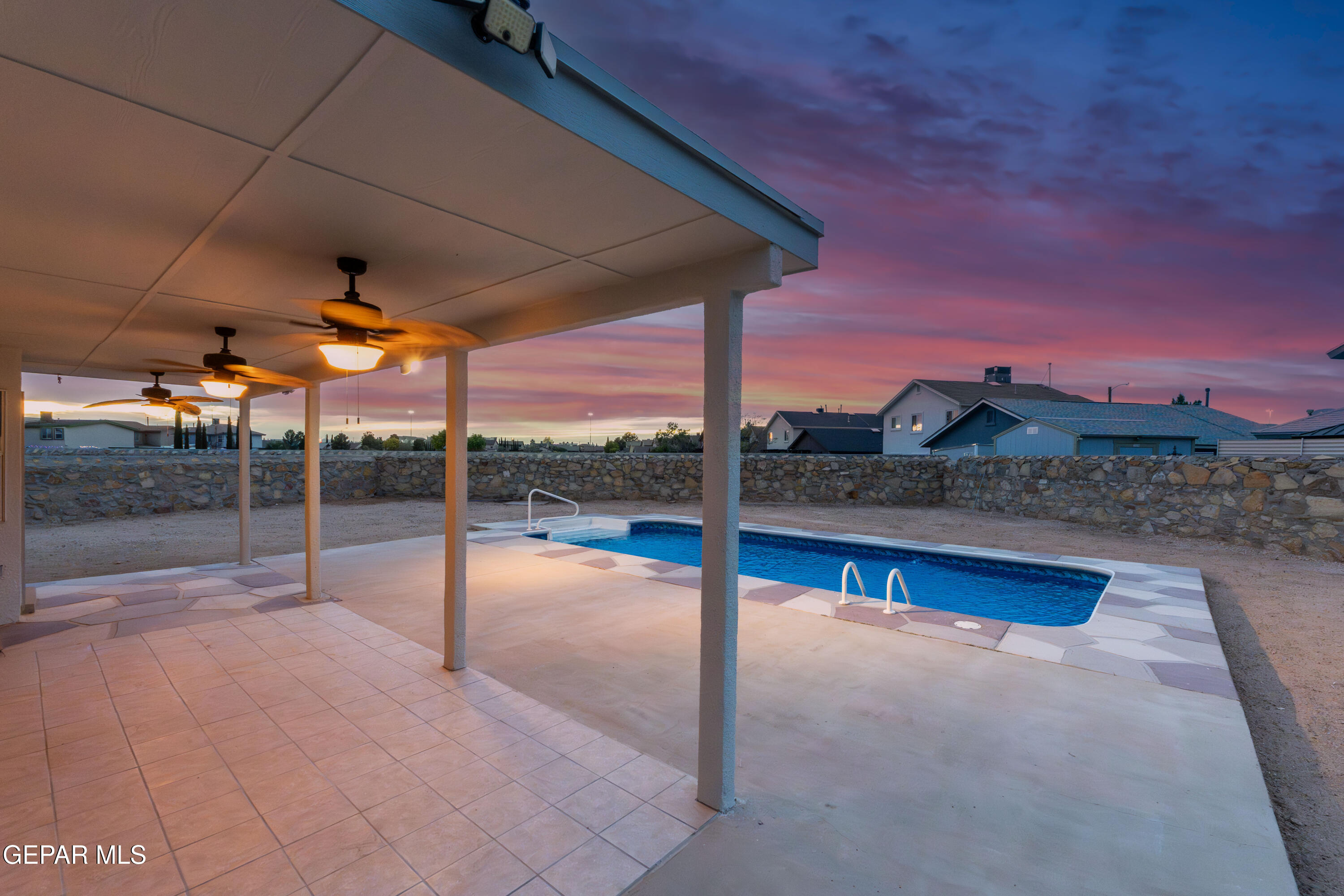 3849 Tierra Roca Place El Paso, TX 79938 - Photo 38 of 44 a view of a terrace with a floor to ceiling window