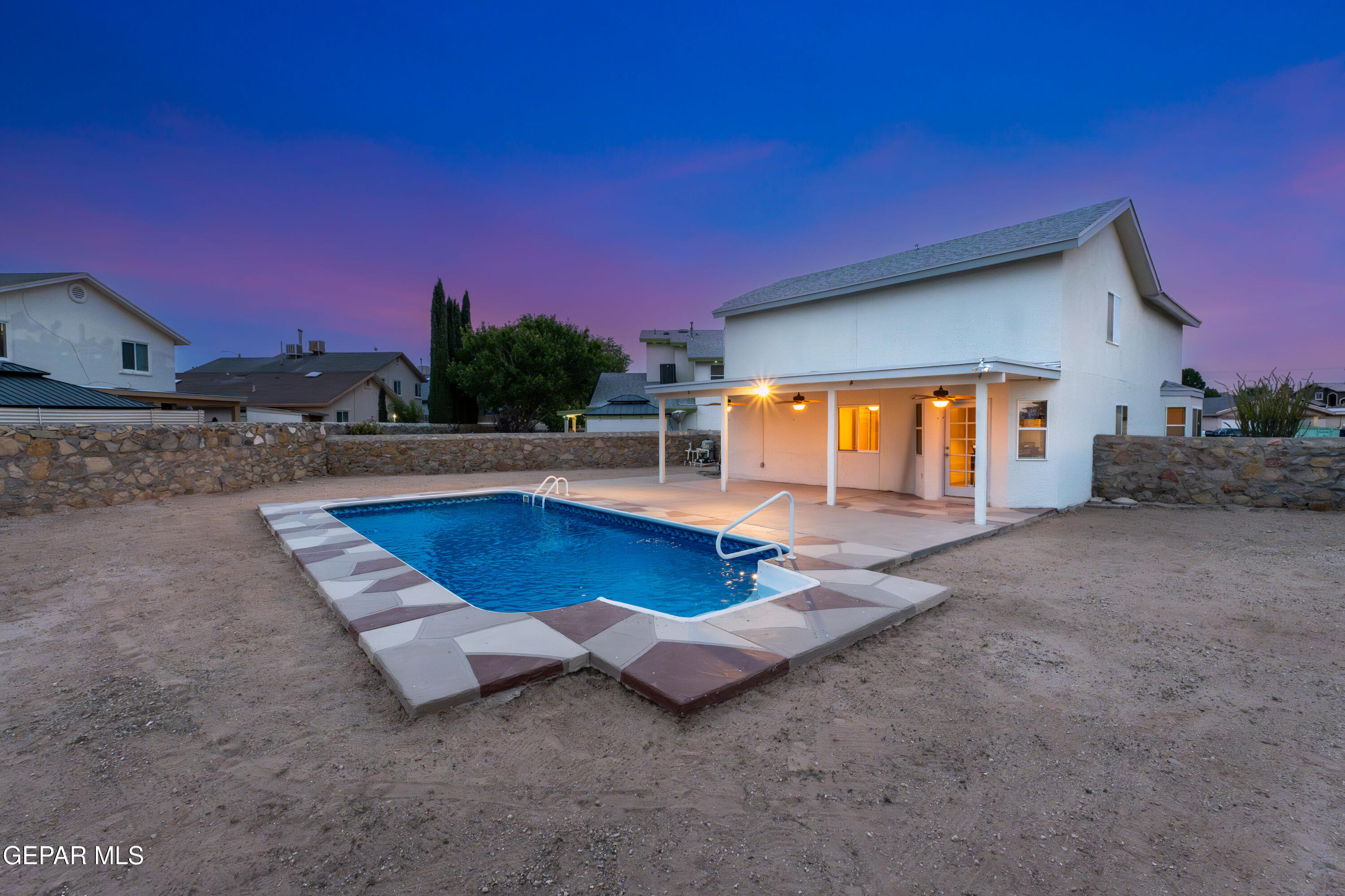 3849 Tierra Roca Place El Paso, TX 79938 - Photo 42 of 44 a backyard of a house with yard and outdoor seating