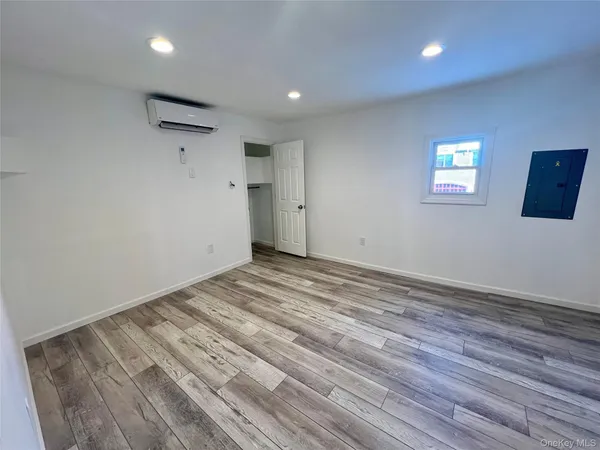 a kitchen with stainless steel appliances a sink a stove a refrigerator and cabinets