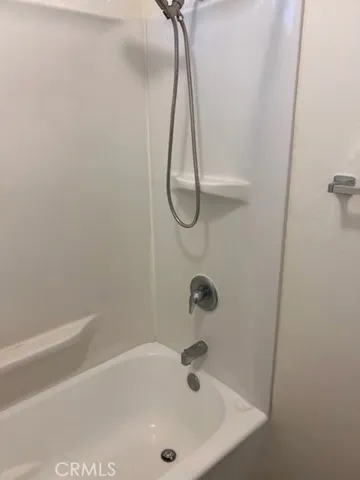 a bathroom with a sink and a shower