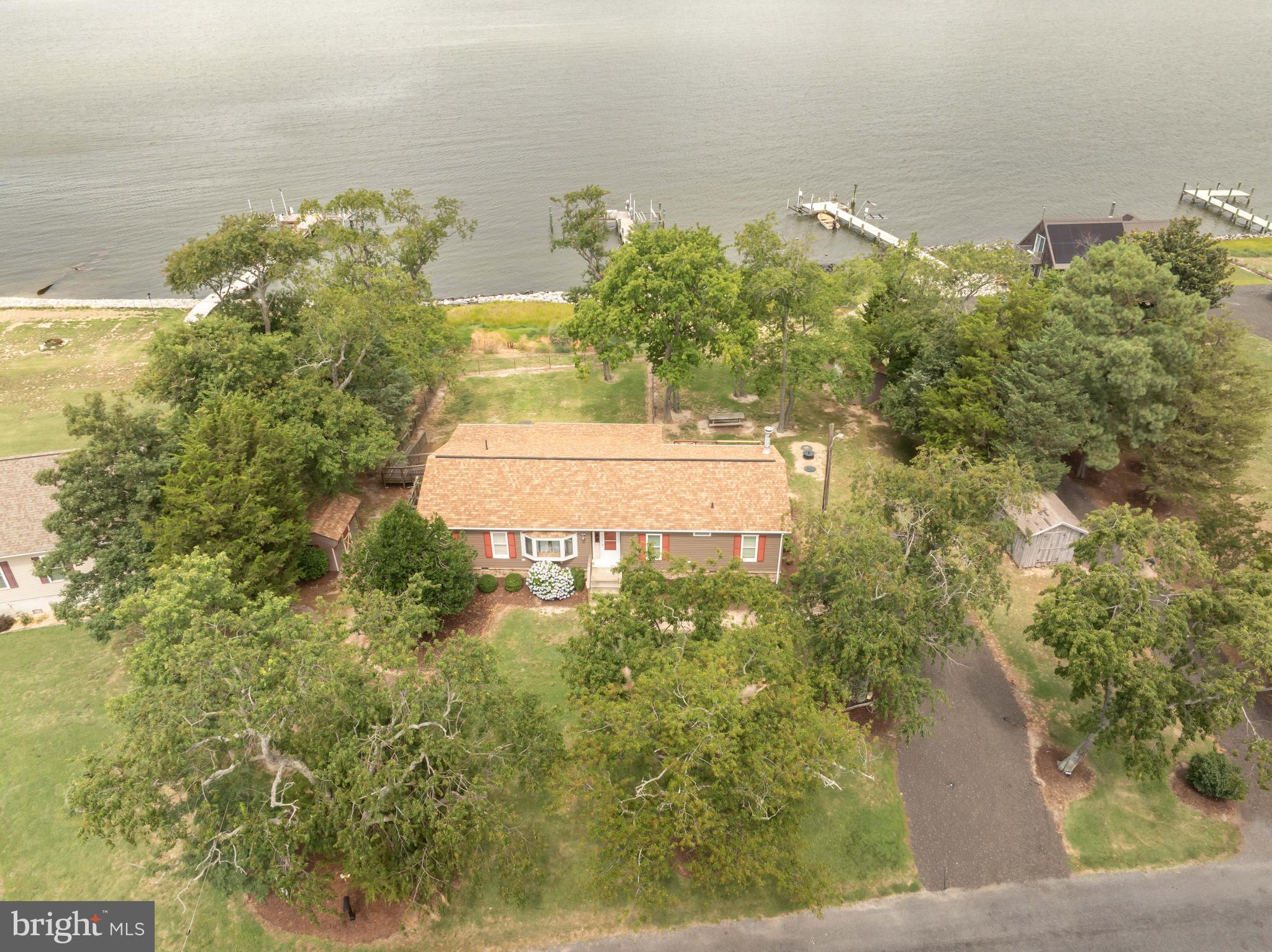 7940 Riverview Road Westover, MD 21871 - Photo 1 of 93 a view of a lake with a yard