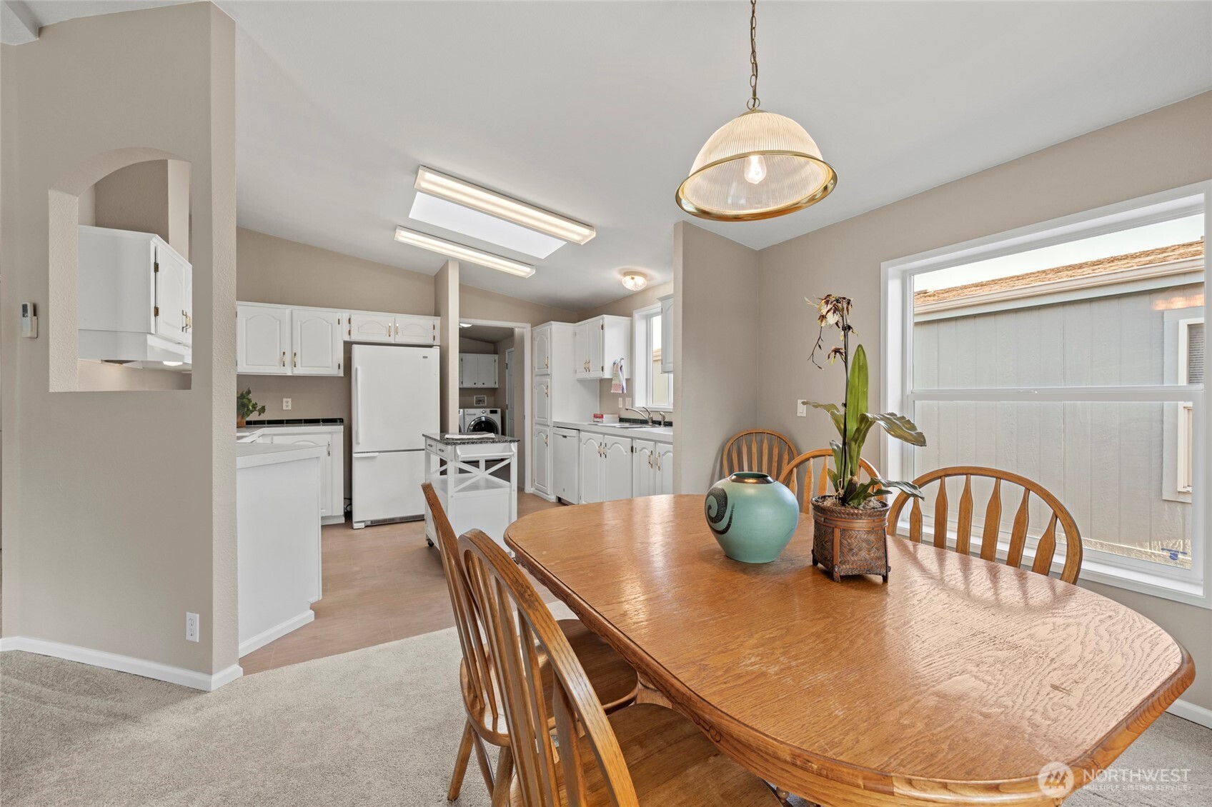23825 15th Avenue Southeast, Unit 108 Bothell, WA 98021 - Photo 9 of 39 a dining room with furniture and window