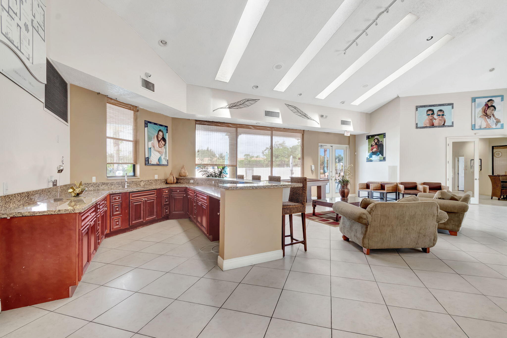 1601 Windorah Way, Unit D West Palm Beach, FL 33411 - Photo 21 of 41 a living room with furniture and a large window