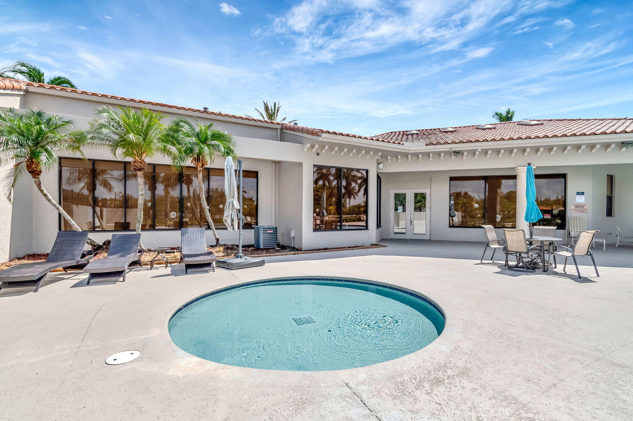 1601 Windorah Way, Unit D West Palm Beach, FL 33411 - Photo 23 of 41 a view of a house with outdoor seating area