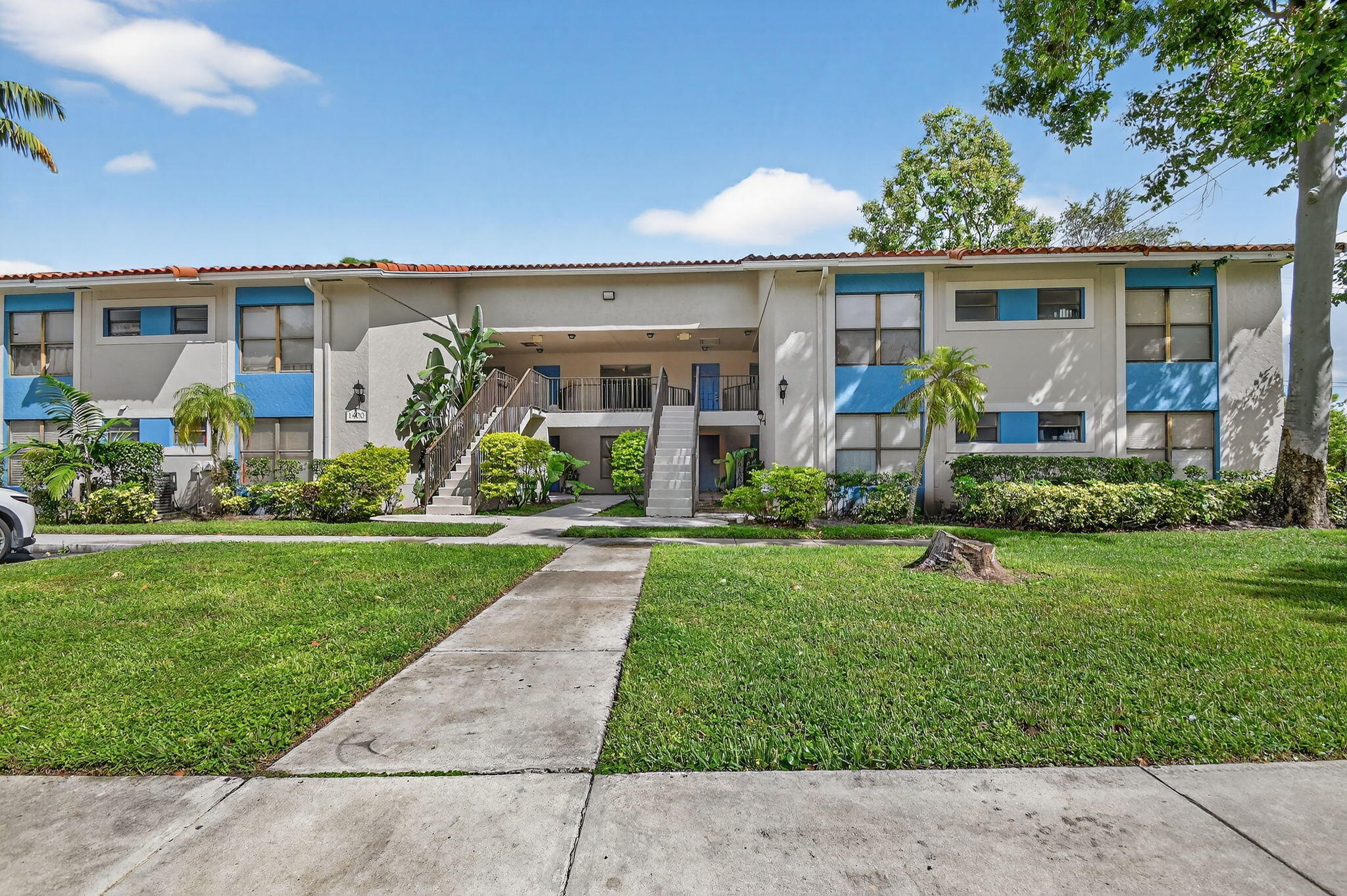 1601 Windorah Way, Unit D West Palm Beach, FL 33411 - Photo 39 of 41 front view of a house with a yard