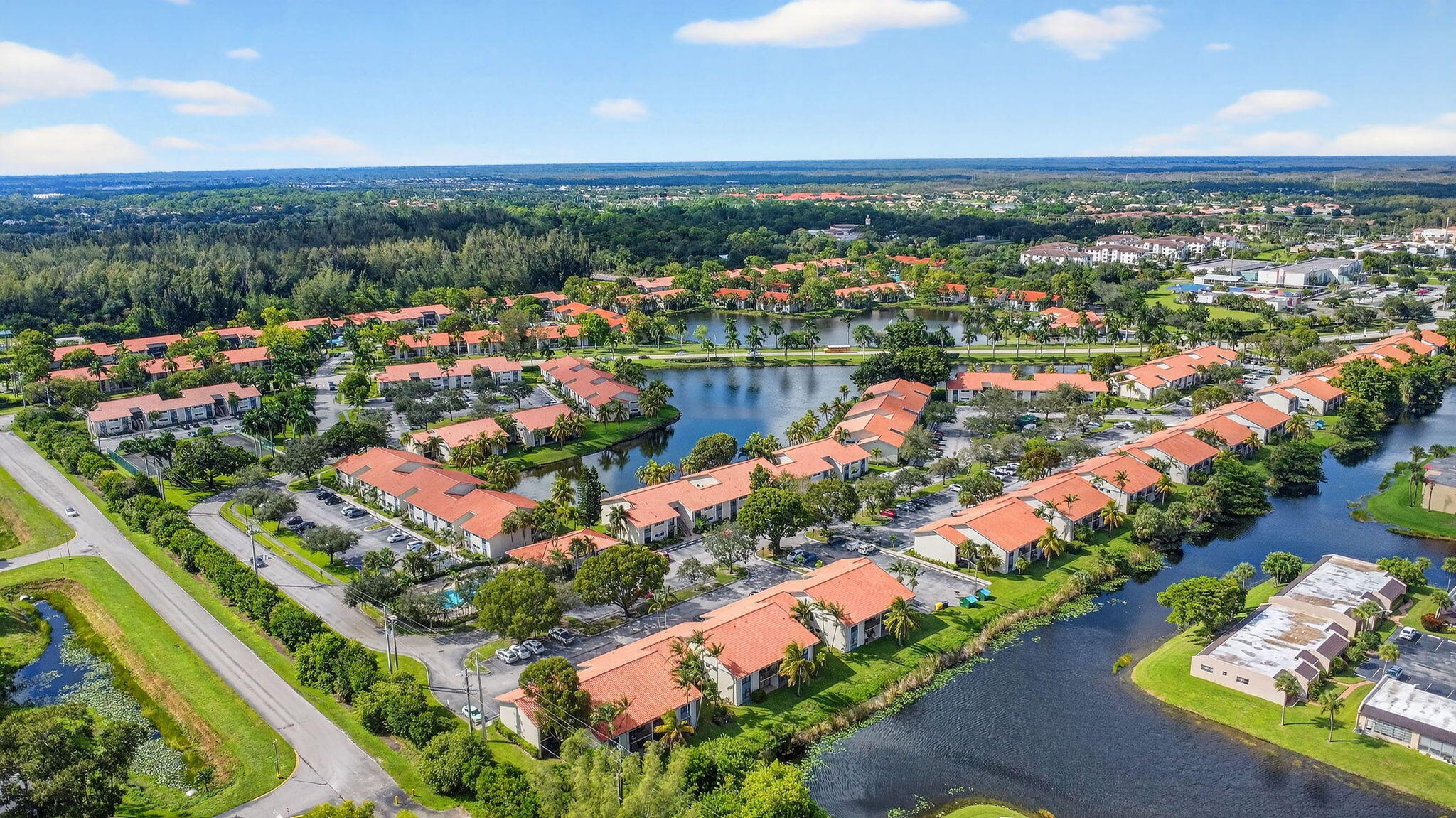 1601 Windorah Way, Unit D West Palm Beach, FL 33411 - Photo 6 of 41 an aerial view of lake and residential houses with outdoor space