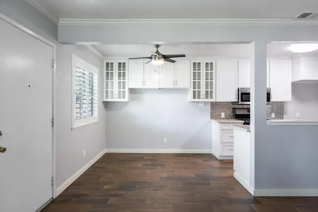 a view of a kitchen with refrigerator and cabinet