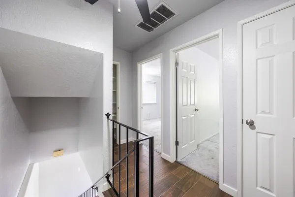 a view of an entryway with wooden floor