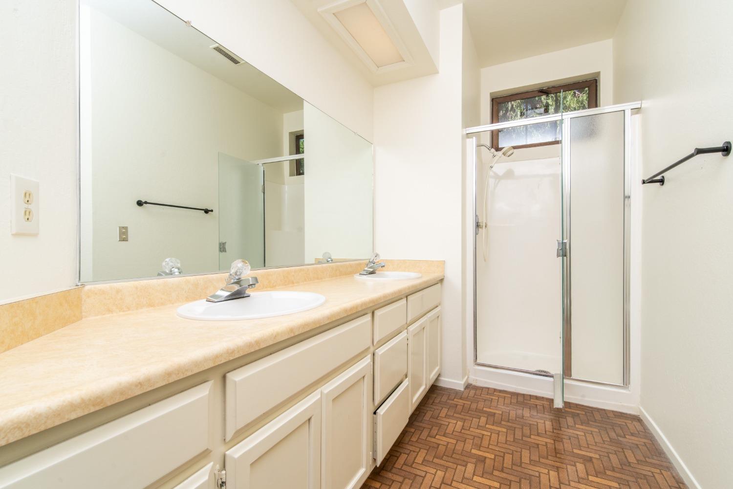 3961 7 Ridges Road Camino, CA 95709 - Photo 64 of 86 a bathroom with a sink and a mirror