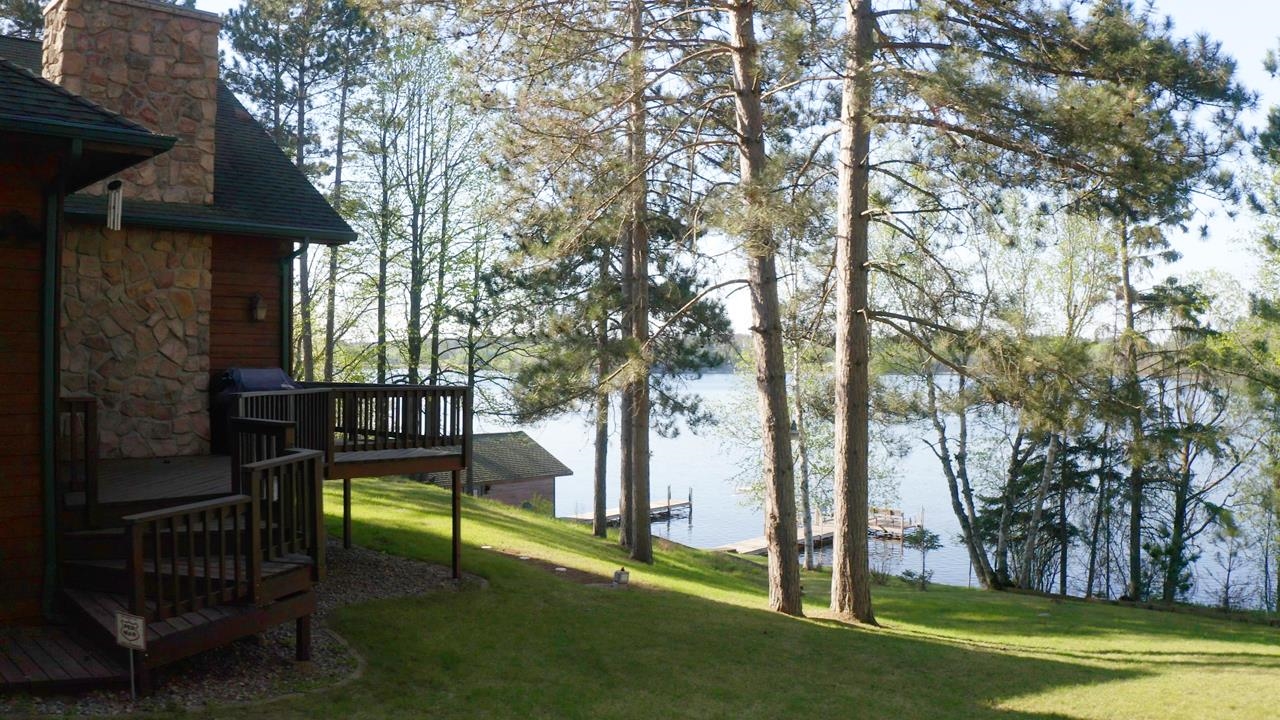 1880 Everett Bay Road Tower, MN 55790 - Photo 40 of 50 View of grassy yard featuring a deck with water view