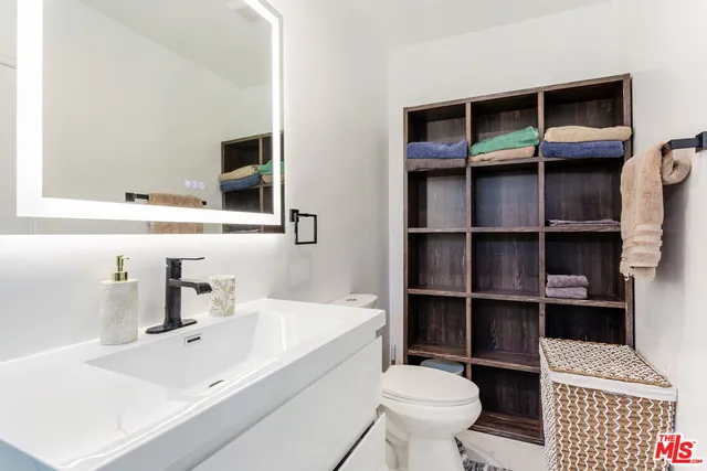 a bathroom with a sink a toilet and a bathtub