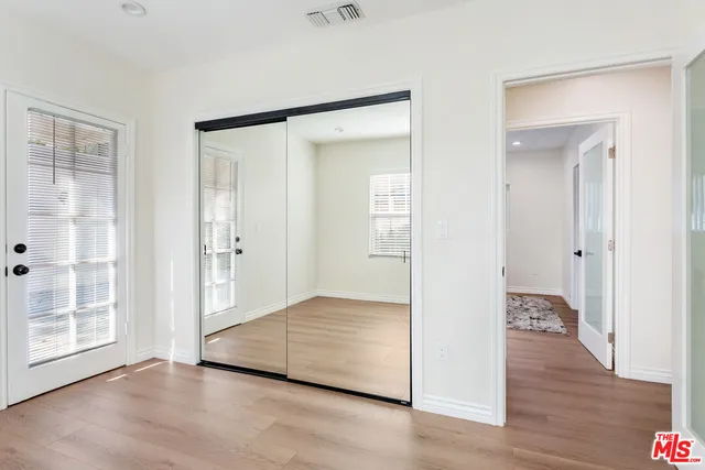 a view of entryway with wooden floor