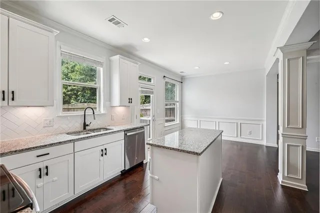 a kitchen with sink and window