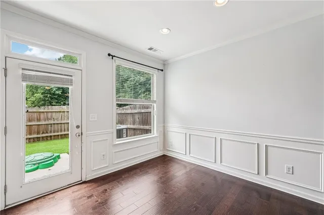 a view of a hallway with a chandelier fan