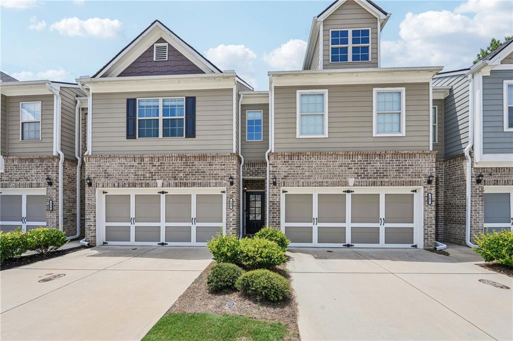 208 Trailside Way Hiram, GA 30141 - Photo 2 of 45 a front view of a house with a yard