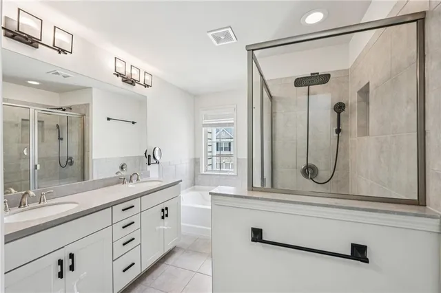 a bathroom with a bathtub and a shower