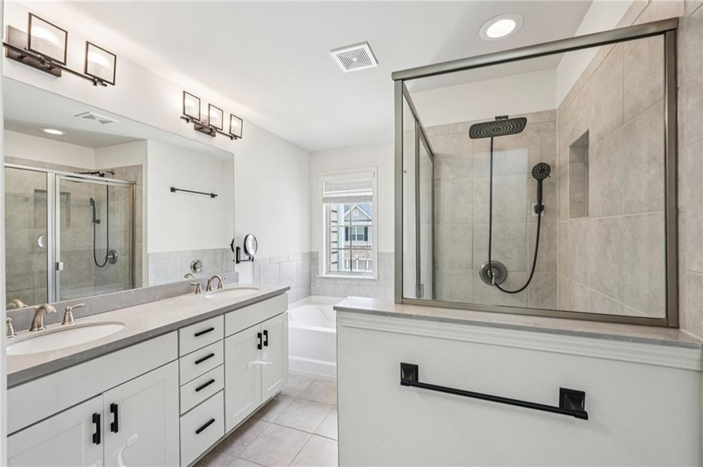 208 Trailside Way Hiram, GA 30141 - Photo 25 of 45 a bathroom with a granite countertop sink mirror and a shower