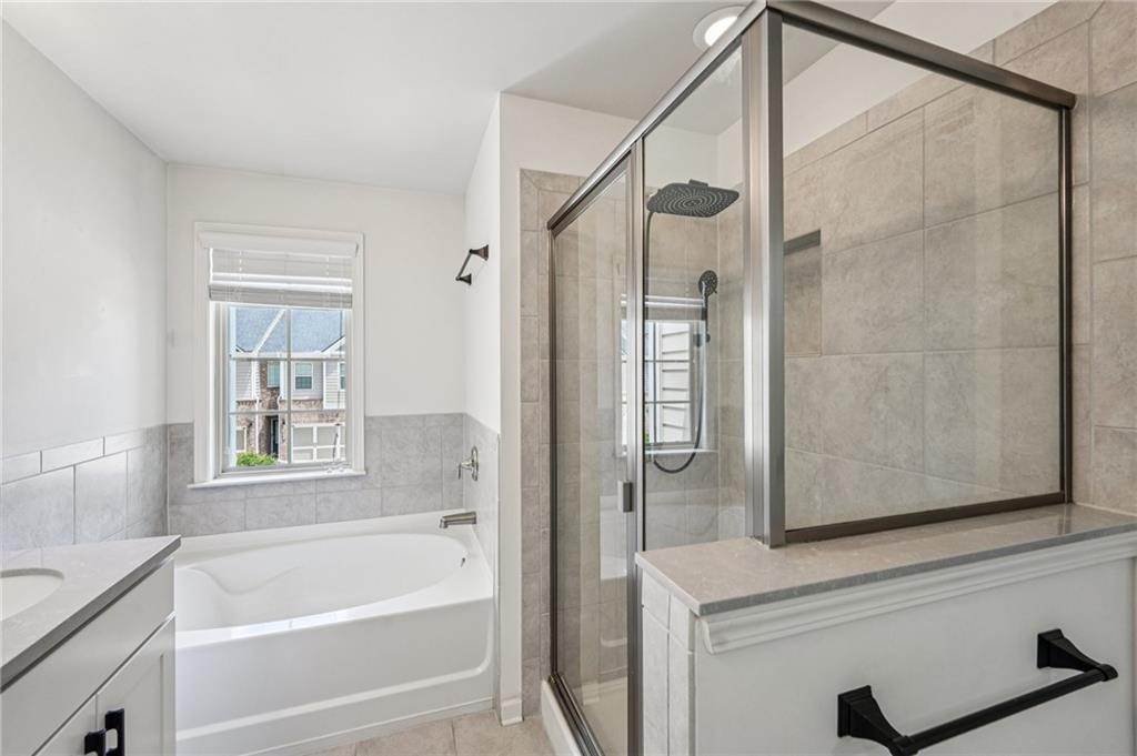 208 Trailside Way Hiram, GA 30141 - Photo 26 of 45 a bathroom with a bathtub and a shower