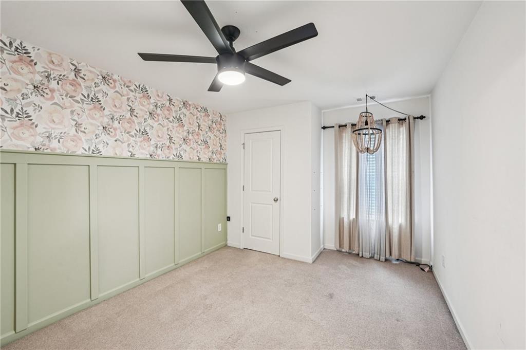208 Trailside Way Hiram, GA 30141 - Photo 28 of 45 an empty room with a ceiling fan and a window