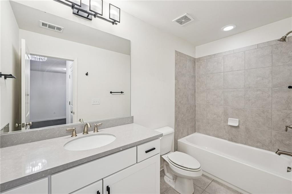 208 Trailside Way Hiram, GA 30141 - Photo 31 of 45 a bathroom with a granite countertop sink toilet and shower