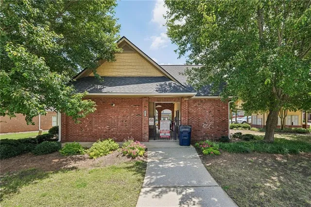 a view of a park with large trees