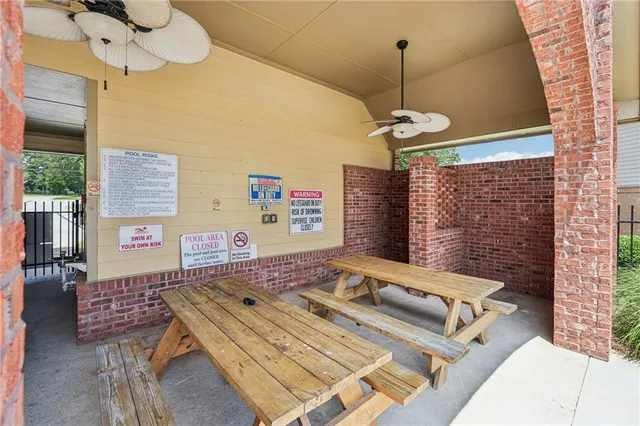 a roof deck with table and chairs