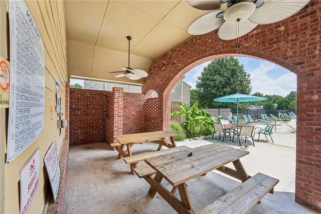 a view of a house with yard patio and swimming pool