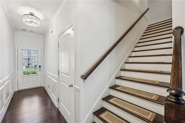 a view of an entryway with wooden floor