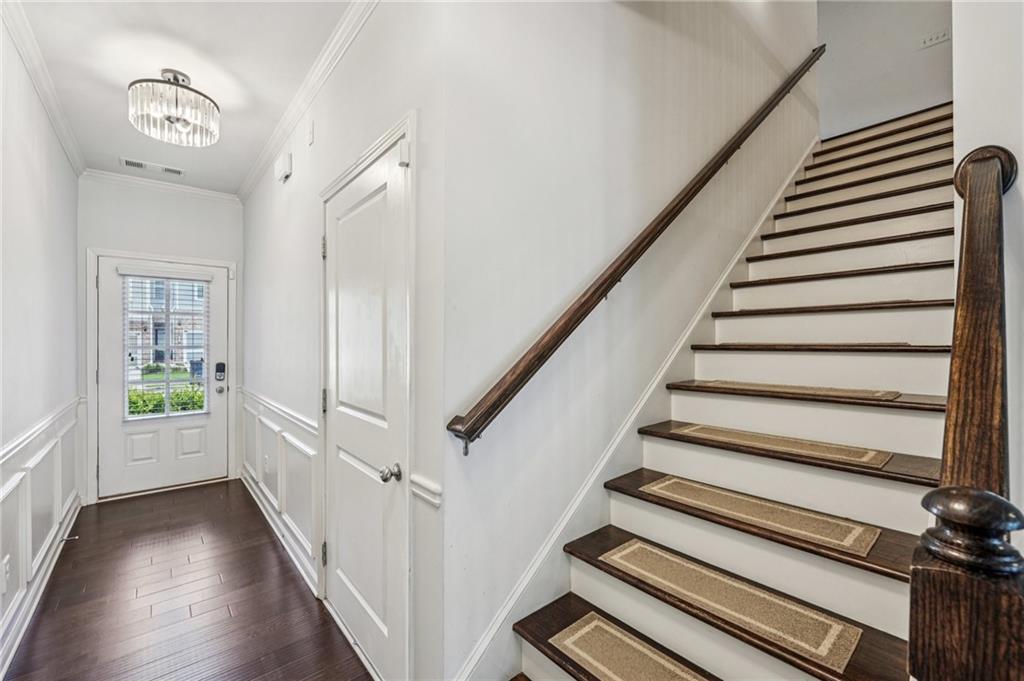 208 Trailside Way Hiram, GA 30141 - Photo 4 of 45 a view of an entryway with wooden floor