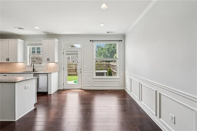 a view of a kitchen with a sink and a window