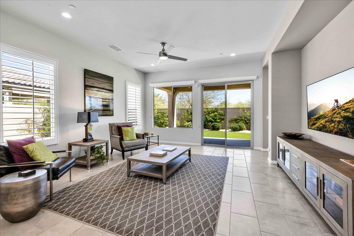 57 Syrah Rancho Mirage, CA 92270 - Photo 11 of 50 a living room with furniture and a flat screen tv