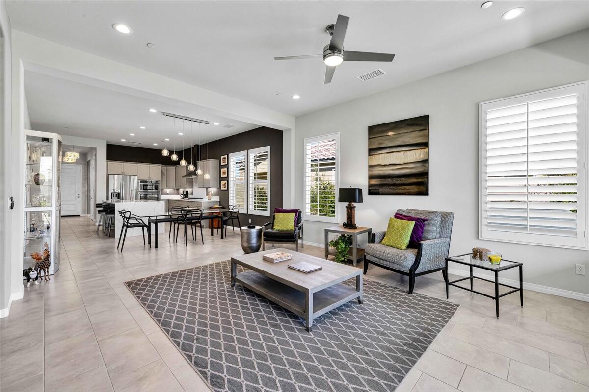 57 Syrah Rancho Mirage, CA 92270 - Photo 13 of 50 a living room with furniture a table and wooden floor