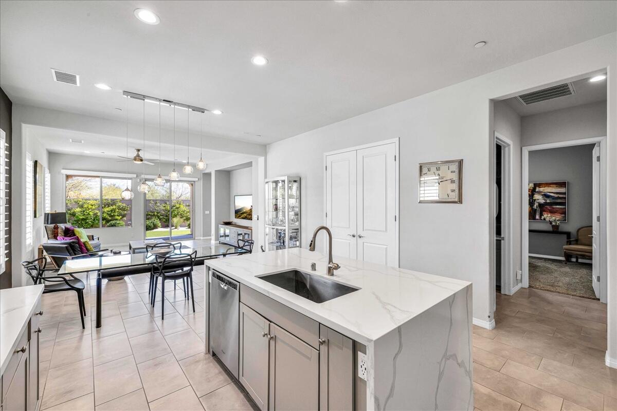 57 Syrah Rancho Mirage, CA 92270 - Photo 15 of 50 a kitchen with counter top space and windows