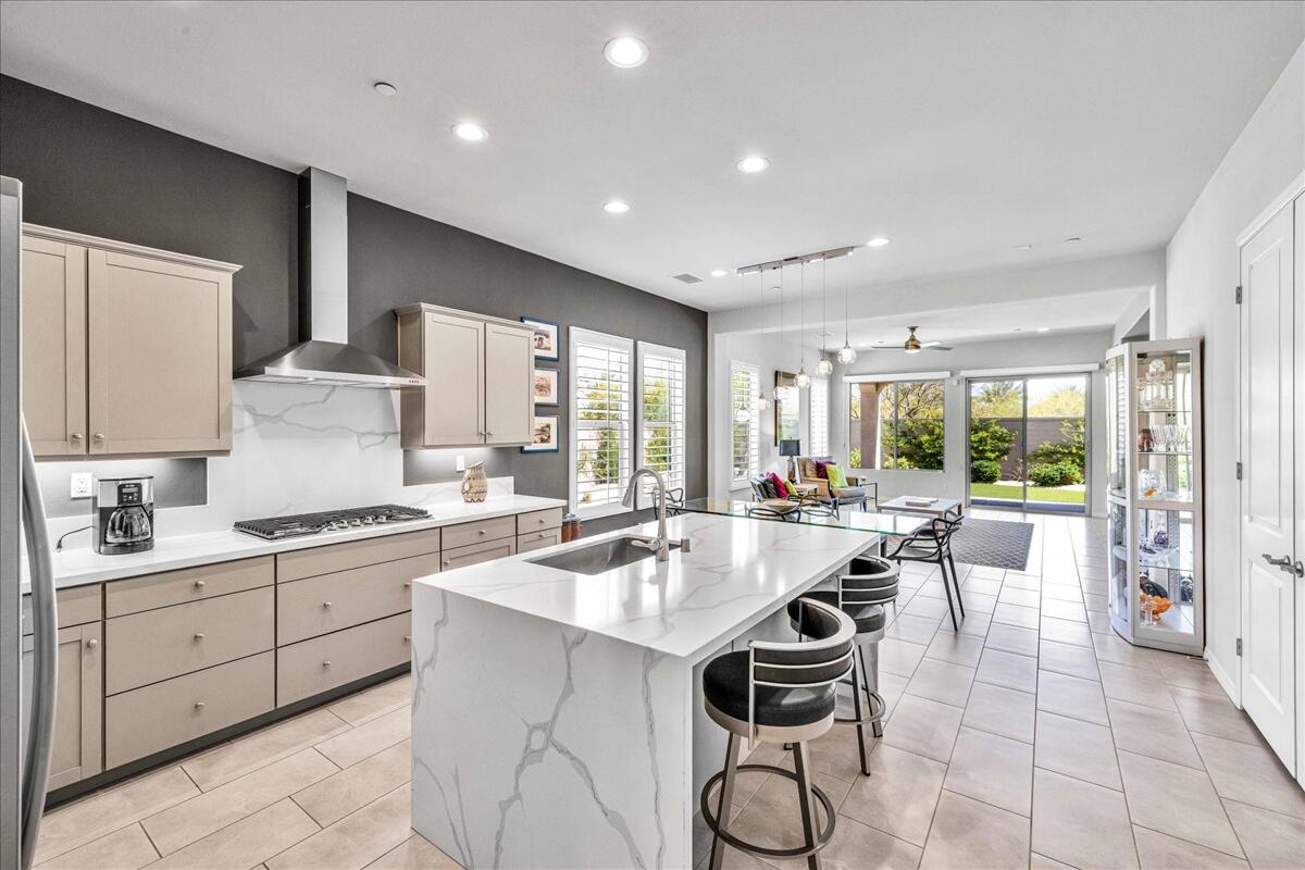 57 Syrah Rancho Mirage, CA 92270 - Photo 2 of 50 a kitchen with a stove a sink and a refrigerator
