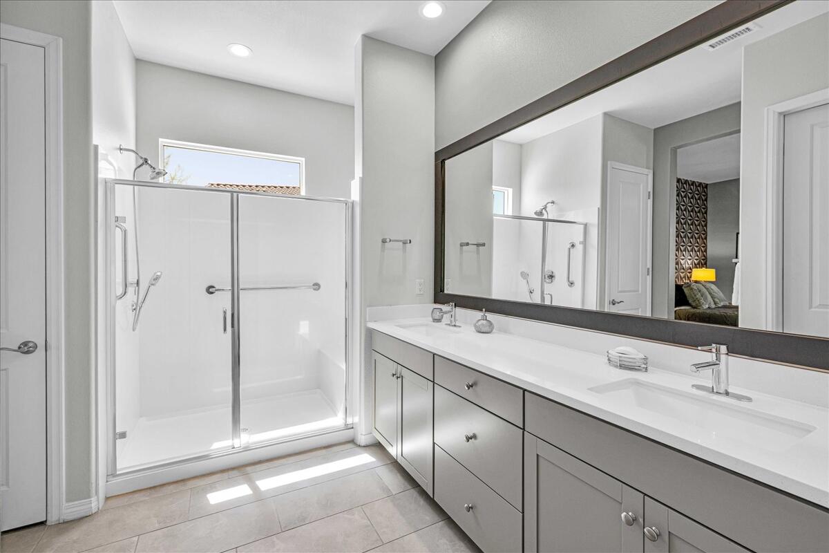 57 Syrah Rancho Mirage, CA 92270 - Photo 21 of 50 a bathroom with a double vanity sink mirror and double