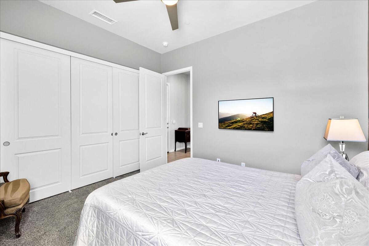 57 Syrah Rancho Mirage, CA 92270 - Photo 23 of 50 a bedroom with a bed and a painting on the wall