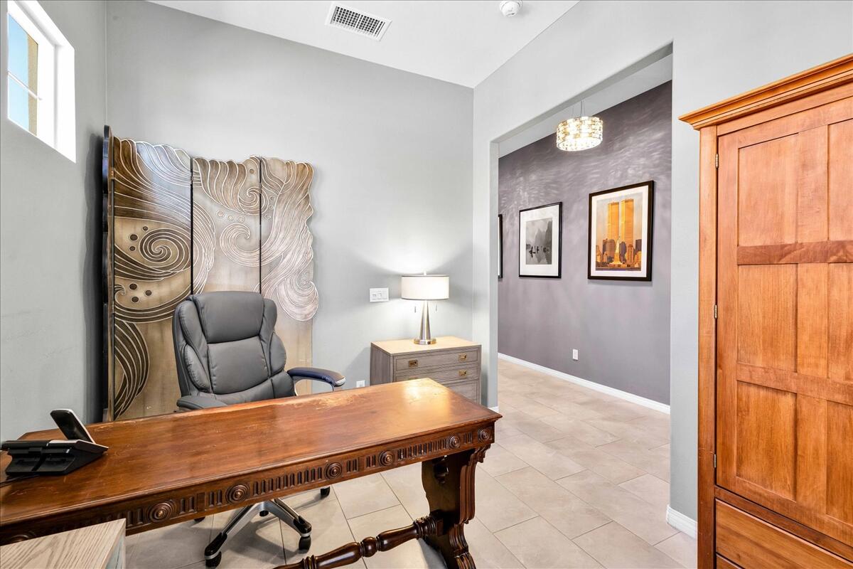 57 Syrah Rancho Mirage, CA 92270 - Photo 25 of 50 a bed room with a bed and a television