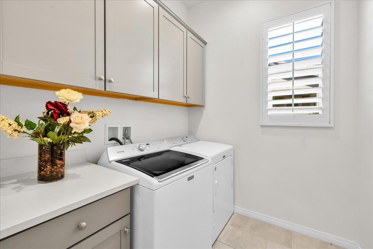 57 Syrah Rancho Mirage, CA 92270 - Photo 27 of 50 a kitchen with a sink and cabinets