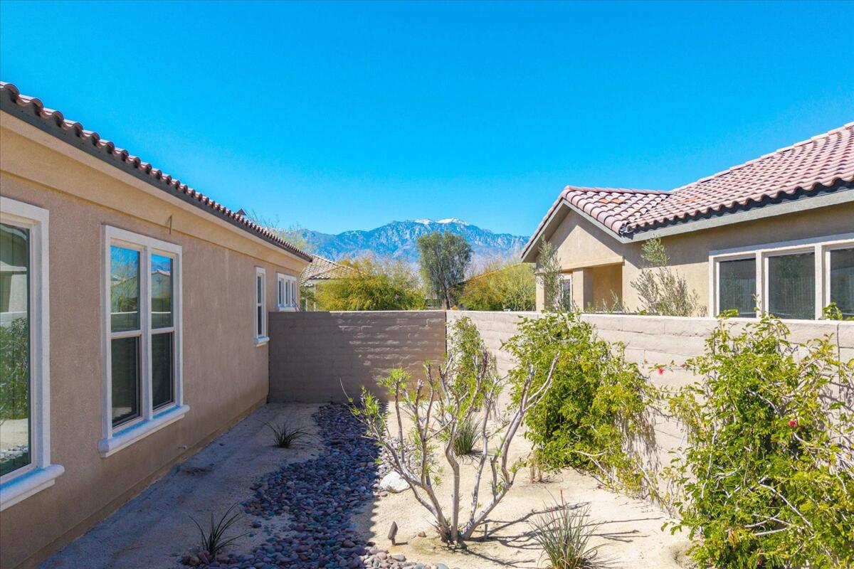 57 Syrah Rancho Mirage, CA 92270 - Photo 45 of 50 a front view of a house with a yard