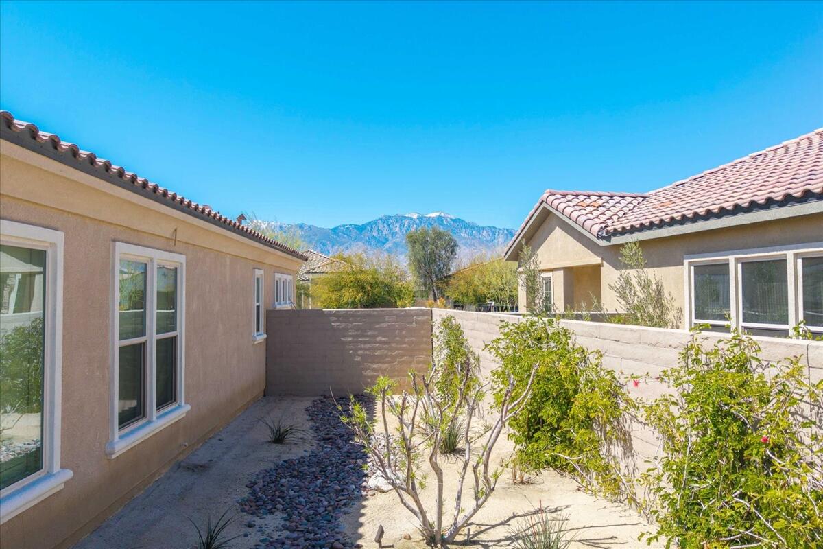 57 Syrah Rancho Mirage, CA 92270 - Photo 47 of 50 a front view of a house with a garden