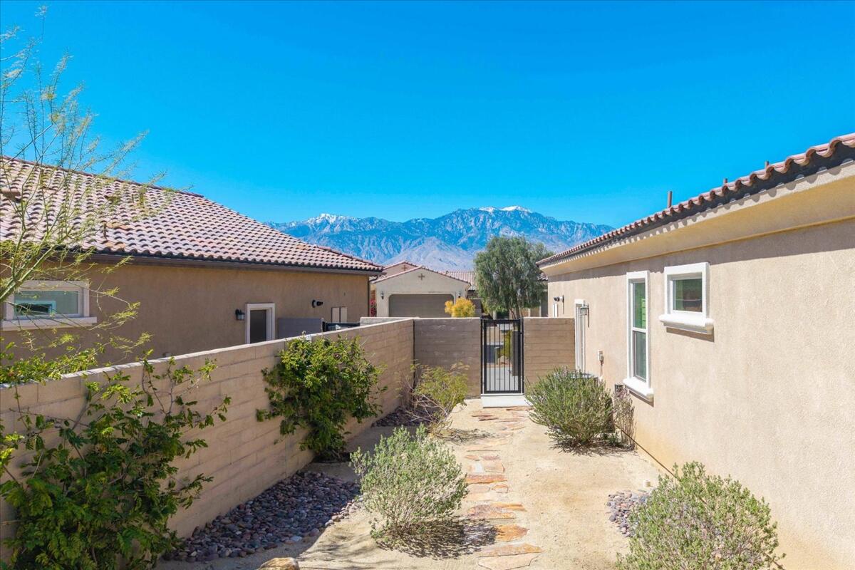 57 Syrah Rancho Mirage, CA 92270 - Photo 49 of 50 a front view of a house with a yard