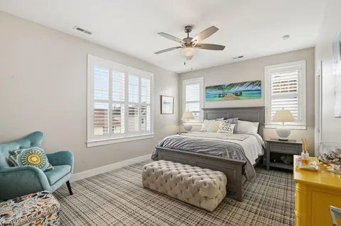 a very nice looking room with a large window and furniture