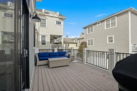 a spacious bedroom with a bed and wooden floor