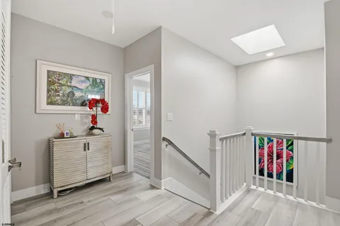 a bedroom with a bed and a flat tv screen on dresser